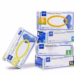 Stack of Medline FitGuard Touch nitrile exam glove boxes in sizes XS, S, M, L, and XL.