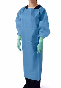 Blue disposable isolation gown with long sleeves and elastic cuffs worn with green medical gloves.