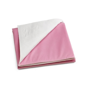 Pink washable underpad with quilted white absorbent top layer for reusable bed and furniture protection.